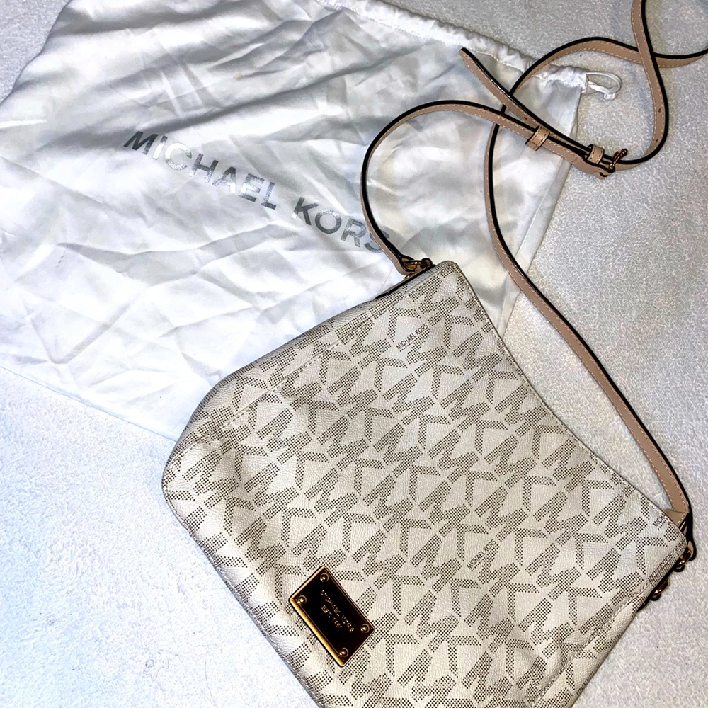 Michael Kors cross body bag! …the duster has seen more action than the purse